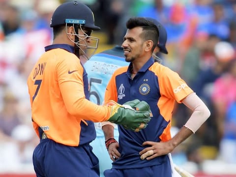 India's MS Dhoni (left) speaks with Yuzvendra Chahal during the World Cup group stage match against England at Edgbaston in Birmingham. 