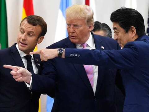 French President Emmanuel Macron and President Trump have not been able to see eye-to-eye on many issues. The digital tax is the latest. They are pictured here with Japanese Prime Minister Shinzo Abe at the G-20 summit in Osaka, Japan. 