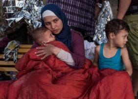 The Big Heart Foundation funds primary care clinic at Jordan's Zaatari Camp Syrian refugee Asmaa holds her 6-month old baby Osman while her 5-year-old boy Abdul-Rahman sits beside her.