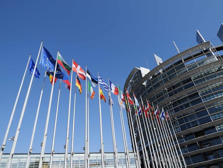 Flags of European Union's countries fly in front of Louise Weiss building (R), headquarters of the European Parliament in Strasbourg, eastern France, in Strasbourg.
