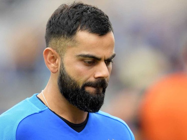 India's captain Virat Kohli reacts 