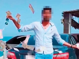Man throws money to show off in Dubai, lands in police custody