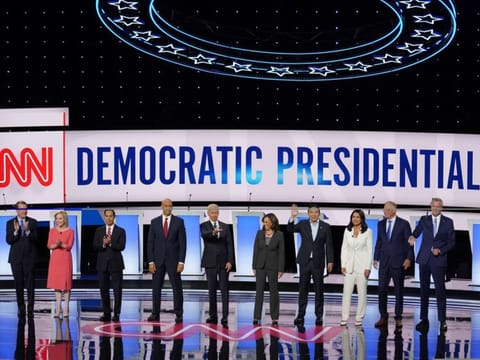 Candidates take the stage before the Democratic presidential debates in Detroit on July 31, 2019. From left: Sen. Michael Bennet, Sen. Kirsten Gillibrand, Former housing secretary Julian Castro, Sen. Cory Booker, former vice-president Joe Biden; Sen. Kamala Harris, Andrew Yang, Rep. Tulsi Gabbard, Gov. Jay Inslee of Washington and New York City Mayor Bill de Blasio.
