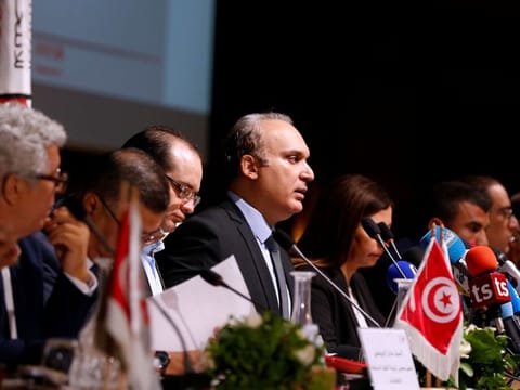 President of Tunisia's independent electoral committee Nabil Baffoun (centre) attends a news conference in Tunis on July 30, 2019. 