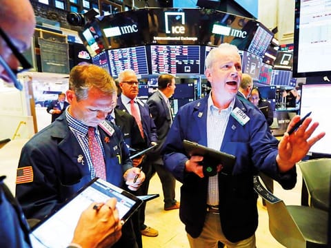 Traders on the floor of New York Stock Exchange.  Investors will keep a lookout this week for updates on US President Donald Trump’s health, alongside any other pandemic-related macroeconomic news that can worsen tensed-up sentiments.