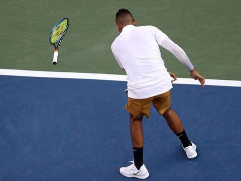 Nick Kyrgios of Australia smashes another racket 