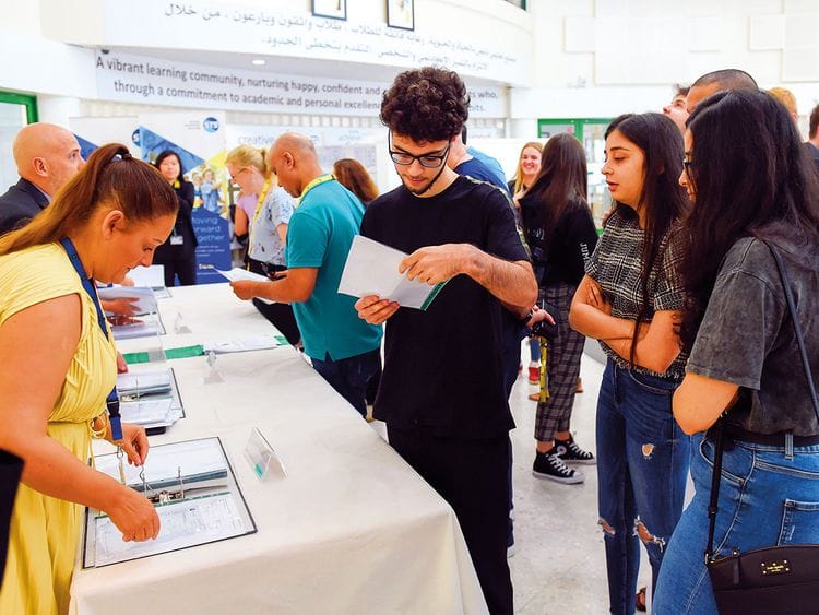 Students check out their A Level results at GEMS Jumeirah College in Dubai