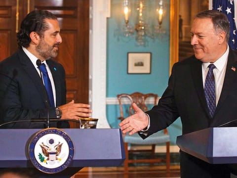 U.S. Secretary of State Mike Pompeo shakes hands with Lebanese Prime Minister Saad Hariri after they spoke to members of the media at the State Department August 15, 2019 in Washington, DC. 