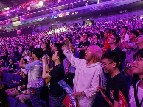 Fans cheer for their teams during the opening ceremony of the International Dota 2 Championships in Shanghai.