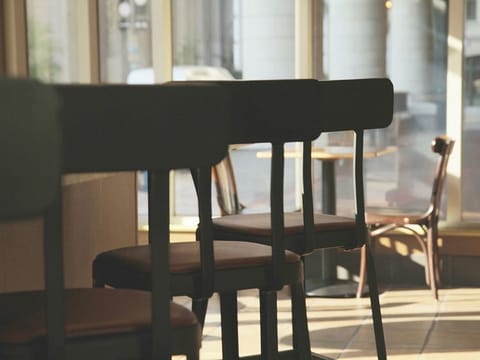 Empty chairs at a restaurant. For illustrative purposes only.