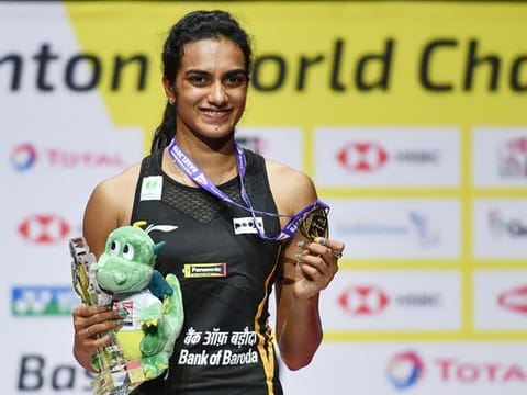 P.V. Sindhu poses with the gold medal during the podium cermony after her victory at the World Championship.