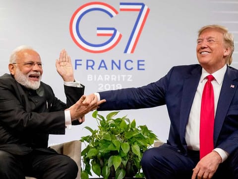 Indian Prime Minister Narendra Modi and President Donald Trump share a laugh in Biarritz, France, last year