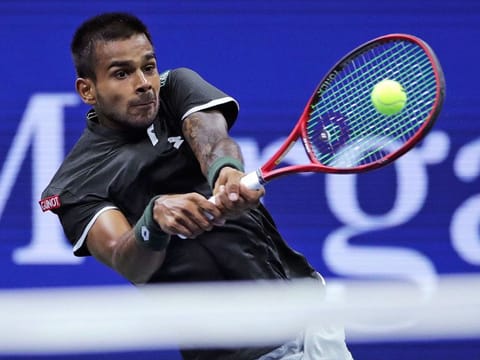 Sumit Nagal returns to Roger Federer during the first round of the US Open tennis tournament in New York, on August 26, 2019. 