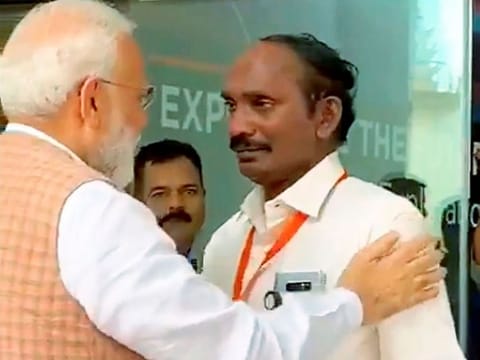 Prime Minister Narendra Modi consoles ISRO Chairman Kailasavadivoo Sivan as he got emotional after  the Vikram lander connection was lost during soft landing of Chandrayaan 2 on lunar surface, in Bengaluru, Saturday, Sept. 7, 2019. 