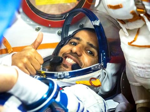  Hazza Al Mansouri flashes a thumbs up as he runs through procedures aboard the Soyuz MS-15 spacecraft during an initial Soyuz vehicle fit check.