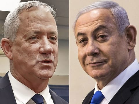  Retired Israeli General Benny Gantz (L), leader and candidate of the Israel Resilience party that is part of the Blue and White (Kahol Lavan) political alliance, speaking to journalists after voting during Israel's parliamentary election at a polling station in Rosh Haayin, and Israeli Prime Minister Benjamin Netanyahu (R) smiling after casting his vote at a polling station in Jerusalem on September 17, 2019