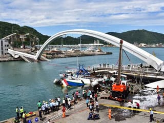 Pictures: Taiwan bridge collapse crushes fishing boats