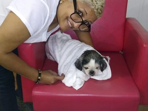 Baldera poses with her dog Virgo in North Andover. 