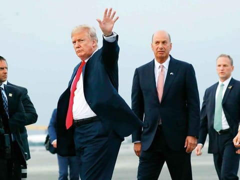  In this Tuesday, July 10, 2018, file photo, President Donald Trump is joined by Gordon Sondland, the U.S. ambassador to the European Union, second from right, as he arrives at Melsbroek Air Base, in Brussels, Belgium.