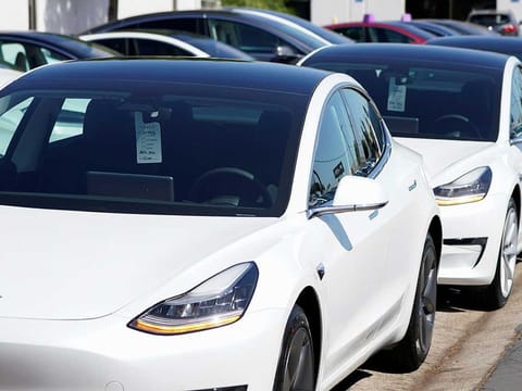 A Tesla Model 3 is shown at a delivery center in San Diego, California.