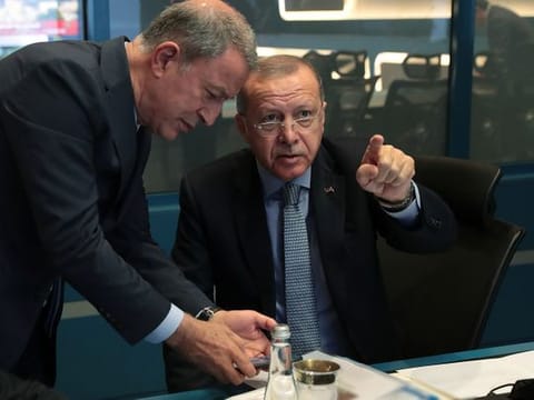 Turkish President Tayyip Erdogan is seen with Defence Minister Hulusi Akar in Ankara, Turkey