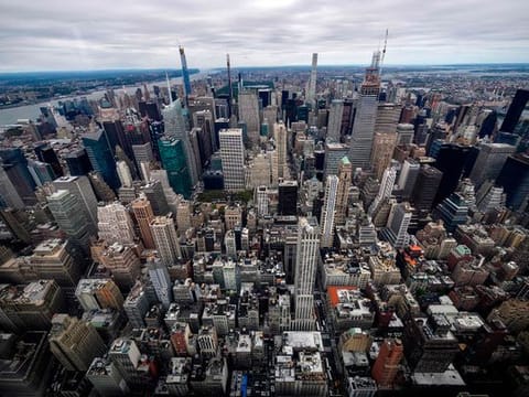 View toward midtown Manhattan inside the newly renovated 102nd floor observatory of the Empire State Building on  October 11, 2019 in New York City.  Opening to the public on October 12, the new 102nd floor observatory is 1250 feet above street level and features 360 degree views of New York City.  