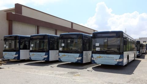 Parked in a hangar in downtown Tripoli on September 3, 2019 , some 35 buses await the launch of a new urban public transport scheme -- the first in the Libyan capital in three decades.  