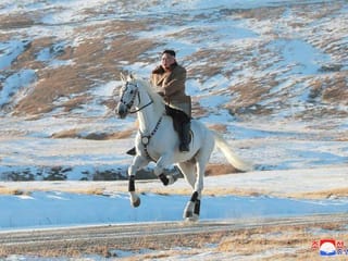  North Korea's Kim Jong Un riding a large white horse on a sacred mountain and the world wonders what it means