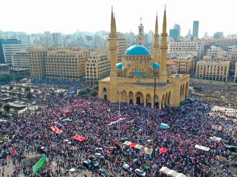 An areal view taken on October 20, 2019, shows Lebanese protesters rallying in downtown Beirut, on the fourth day of demonstrations against tax increases and official corruption. 