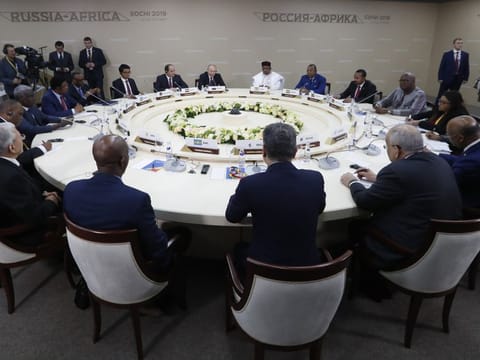 Russian President Vladimir Putin, back centre left, Egyptian President Abdel-Fattah El-Sissi, center second left, and Nigerien President Mahamadou Issoufou, center right, attend a luncheon with the heads of African regional organizations on the sideline of Russia-Africa summit in the Black Sea resort of Sochi, Russia, Wednesday, Oct. 23, 2019