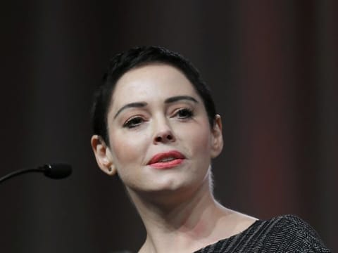 FILE- In this Oct. 27, 2017, file photo, actress Rose McGowan speaks at the inaugural Women's Convention in Detroit. A lawyer for Harvey Weinstein called actress McGowan's claims of rape against the former Hollywood producer are "a bold lie." McGowan details her allegations against Weinstein in her new book "Brave," released Tuesday, Jan. 30, 2018. (AP Photo/Paul Sancya, File)