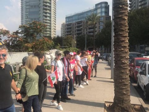 Lebanese gather to form human chain.