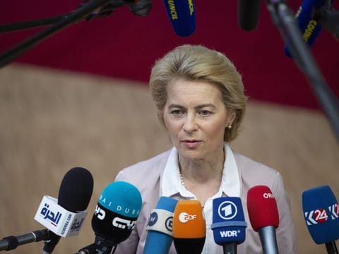 Incoming European Commission President Ursula von der Leyen speaks with the media as she arrives for an EU summit in Brussels.