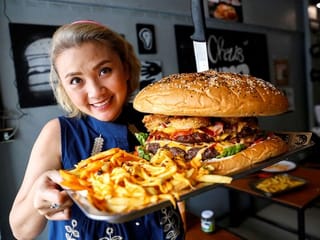 In Pictures: The race to eat Bangkok's 'biggest burger', a 10,000-calorie challenge 
