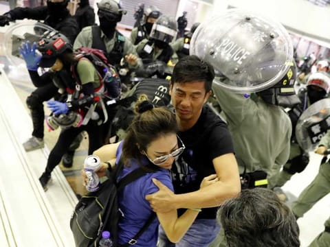 People scuffle with riot police at a shopping mall in Tai Po in Hong Kong on November 3.