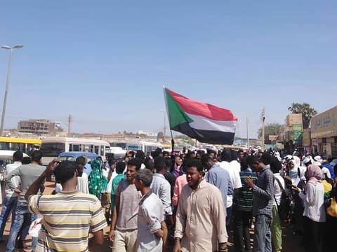 Protesters march in  Wad Madani, the provincial capital of al-Jazirah province, Sudan, Sunday, Nov. 3, 2019. 