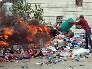 Stinking garbage line the streets of Yemen's historic Taez