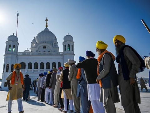 Sikh pilgrims stand in a queue to visit the Shrine of Baba Guru Nanak Dev at Gurdwara Darbar Sahib in Kartarpur, near the Indian border, on November 9, 2019. Hundreds of Indian Sikhs prepared to make a historic pilgrimage to Pakistan on November 9 crossing to one of their religion's holiest sites under a landmark deal between the two countries separated by the 1947 partition of the subcontinent.