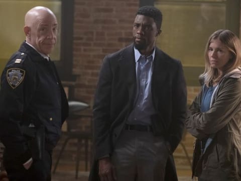 (L-r) J.K. Simmons, Chadwick Boseman and Sienna Miller  in “21 Bridges.” MUST CREDIT: Matt Kennedy/STXfilms