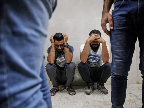 Relatives of Palestinian Zaki Ghanama, 25, mourn in the morgue of a hospital in Beit Lahia in the northern Gaza Strip on November 12, 2019, following an Israeli strike. 