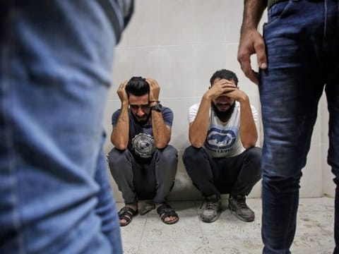 Relatives of Palestinian Zaki Ghanama, 25, mourn in the morgue of a hospital in Beit Lahia in the northern Gaza Strip on November 12, 2019, following an Israeli strike. 