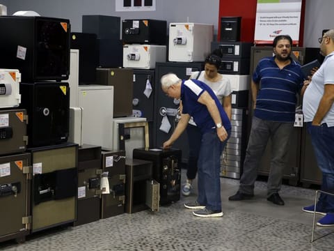 Customers checks the safes for sale at the Shehab Security shop in Beirut, Lebanon, Wednesday, Nov. 20, 2019. 