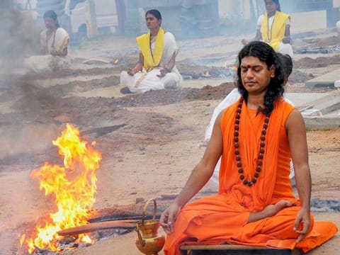 In this June 13, 2010 file photo, self-styled godman Swami Nithyananda performs a ritual with his disciples at his ashram after being released on bail from Ramnagaram Jail near Bangalore. 