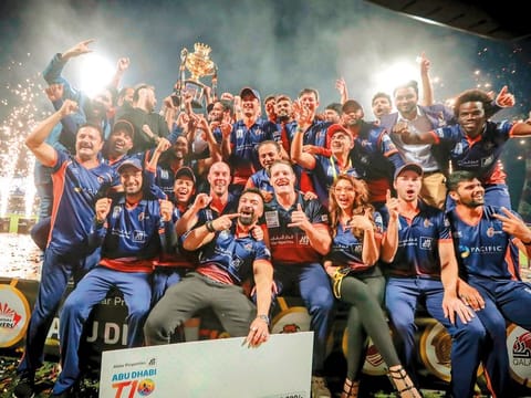 Maratha Arabians team members celebrate after winning the Aldar Abu Dhabi T10 League on Sunday night.