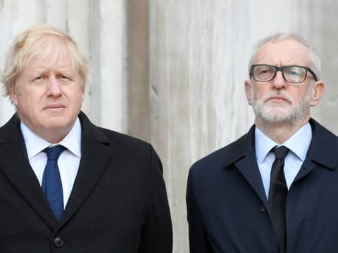 Britain's Prime Minister Boris Johnson and Britain's opposition Labour Party leader Jeremy Corbyn attend a vigil for victims of a fatal attack on London Bridge in London, Britain December 2, 2019.  REUTERS/Toby Melville