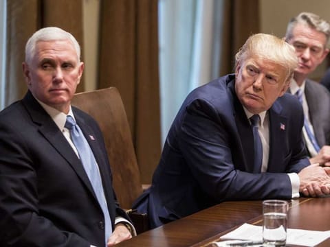 US President Donald Trump and Vice-President Mike Pence listen during a roundtable discussion on the Governors' Initiative on Regulatory Innovation in the Cabinet Room of the White House in Washington, D.C., on Monday.