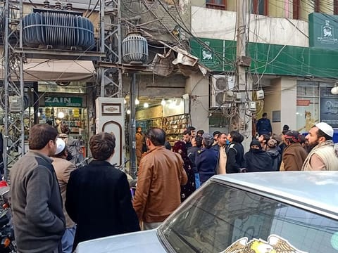 People gather outside buildings following an earthquake tremor in Peshawar, Pakistan December 20, 2019. 