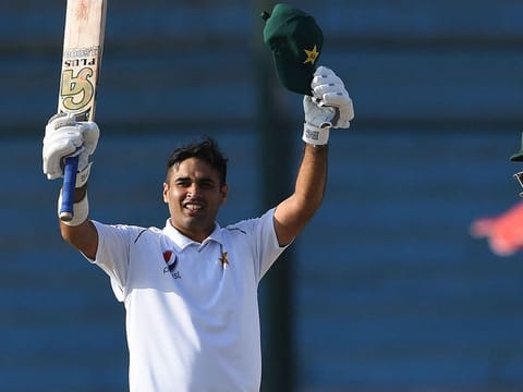 Pakistan's Abid Ali (L) celebrates after scoring 150 runs next to captain Azhar Ali during the third day of the second Test cricket match between Pakistan and Sri Lanka at the National Cricket Stadium in Karachi on December 21, 2019.  