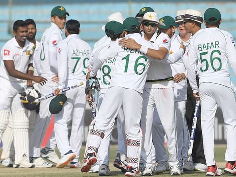 Pakistan players celebrate after winning the second Test cricket match against Sri Lanka at the National Cricket Stadium in Karachi on December 23, 2019.  
