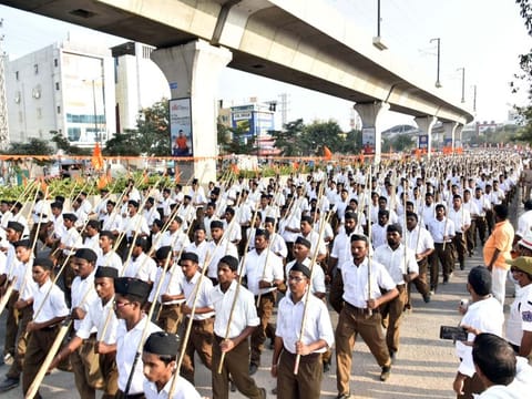  RSS members take part in a 'route march' toward the indoor stadium at Saroornagar in Hyderabad on Wednesday.